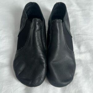 Capezio black dance shoes, child size 7, worn for one season.